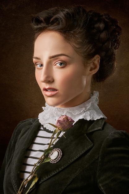 Free photo portrait of the beautiful woman face with a rose