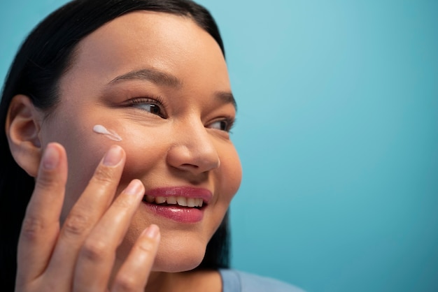 Portrait of beautiful woman during her skincare routine