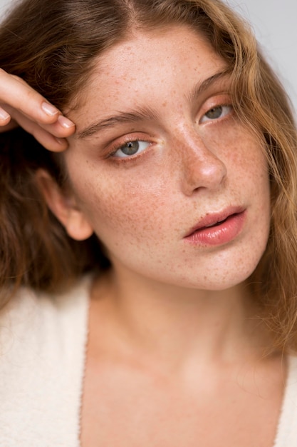 Portrait of beautiful woman posing in an artistic way