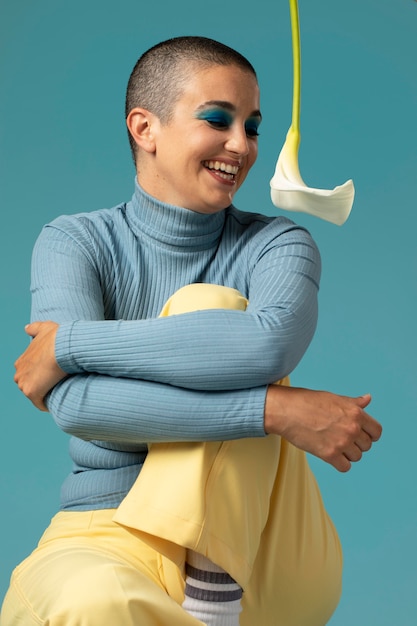 Portrait of beautiful woman posing in a turtleneck with a flower