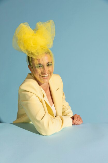 Portrait of beautiful woman posing with an avantgarde head piece