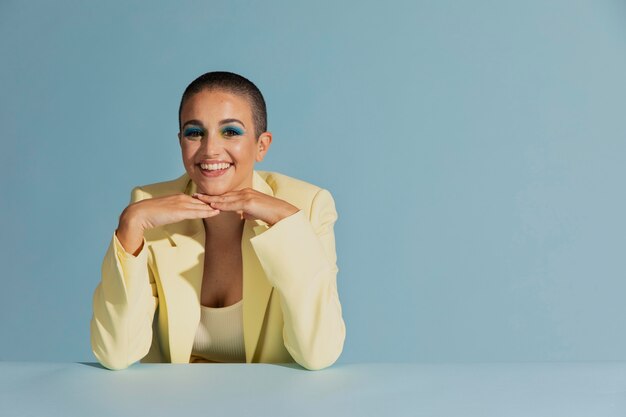 Portrait of beautiful woman posing with a yellow jacket