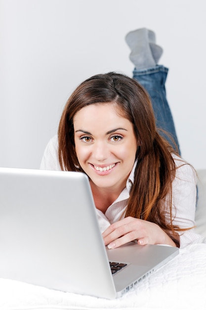 Portrait of beautiful woman using laptop