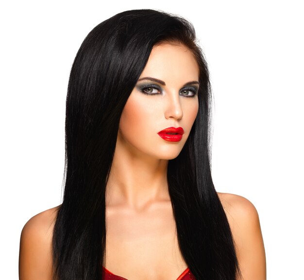 Portrait of  the beautiful woman with  black straight hairs and red lips, evening makeup