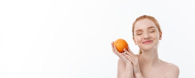 Free photo portrait beautiful woman with a orange isolated