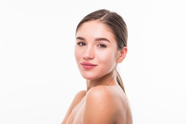 Portrait of beautiful woman with perfect face on white wall