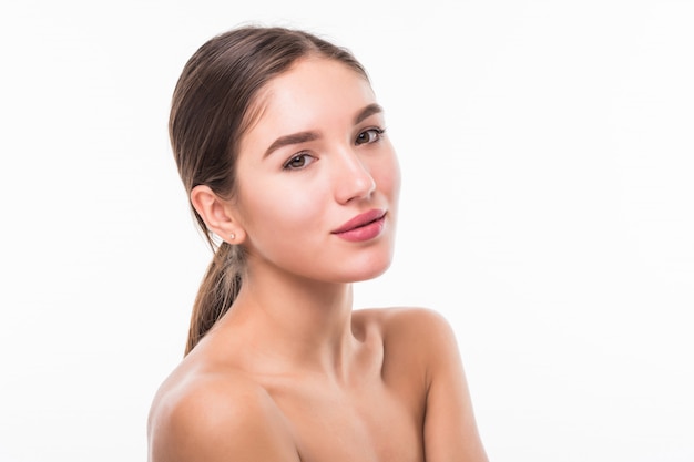 Portrait of beautiful woman with perfect face on white wall