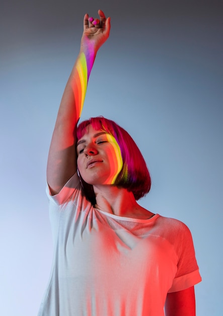 Portrait of beautiful woman with pink hair and lgbt symbol