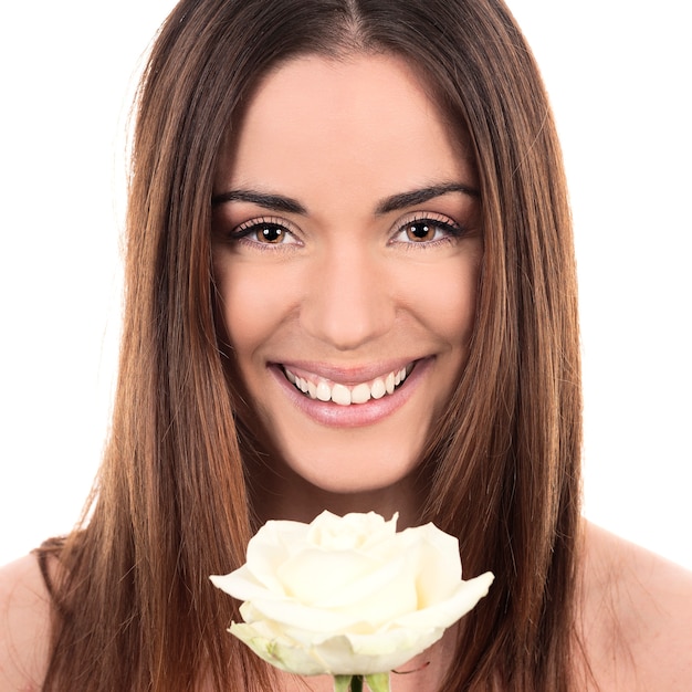 Portrait of beautiful woman with white rose