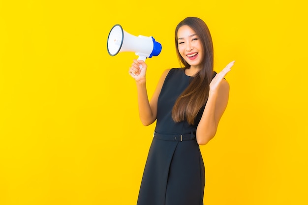 Portrait beautiful young asian business woman use megaphone for communication