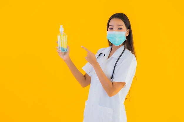 Portrait beautiful young asian doctor woman wear mask with alcohol gel