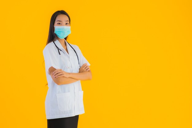 Portrait beautiful young asian doctor woman with mask for protect covid19