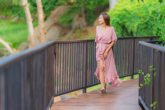 Portrait beautiful young asian woman looking sea beach ocean for relax in holiday vacation travel