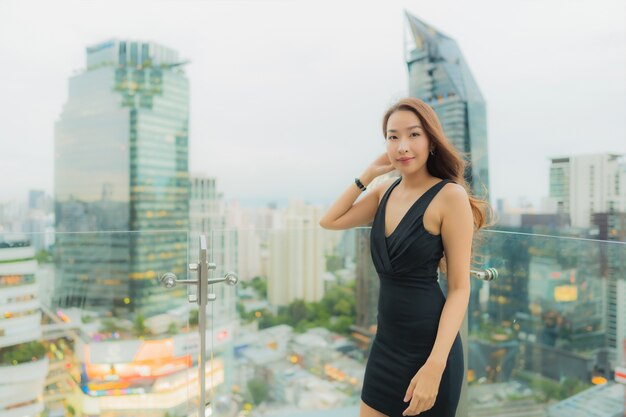 Portrait beautiful young asian woman relax enjoy restaurant on the rooftop