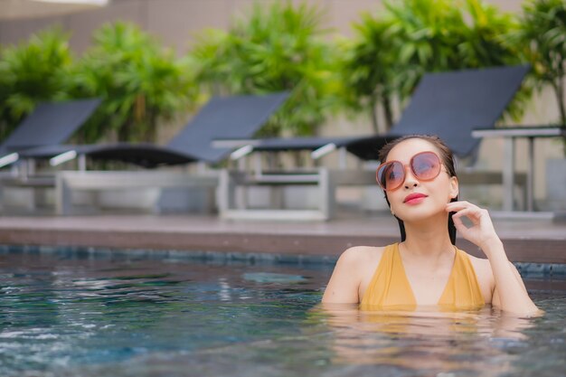 Portrait beautiful young asian woman relax leisure around swimming pool