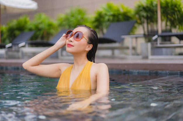 Portrait beautiful young asian woman relax leisure around swimming pool