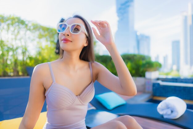 Portrait beautiful young asian woman relax leisure enjoy around outdoor swimming pool