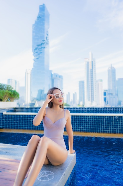 Portrait beautiful young asian woman relax leisure enjoy around outdoor swimming pool