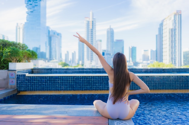 Portrait beautiful young asian woman relax leisure enjoy around outdoor swimming pool