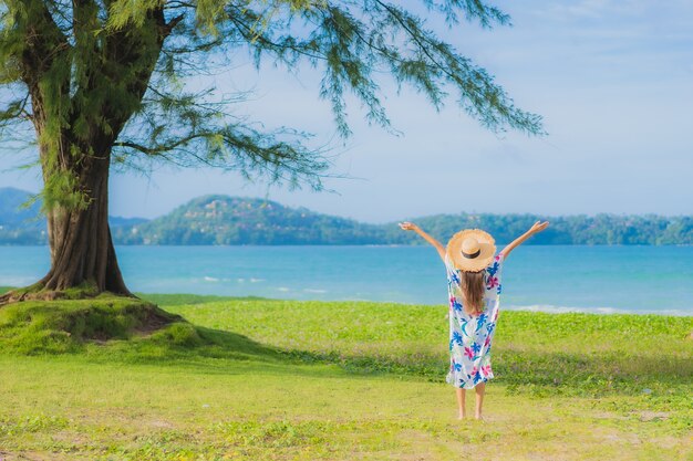 Free Photo portrait beautiful young asian woman relax smile around beach sea ocean in holiday vacation