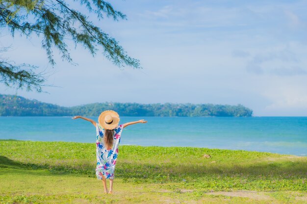 Free Photo portrait beautiful young asian woman relax smile around beach sea ocean in holiday vacation