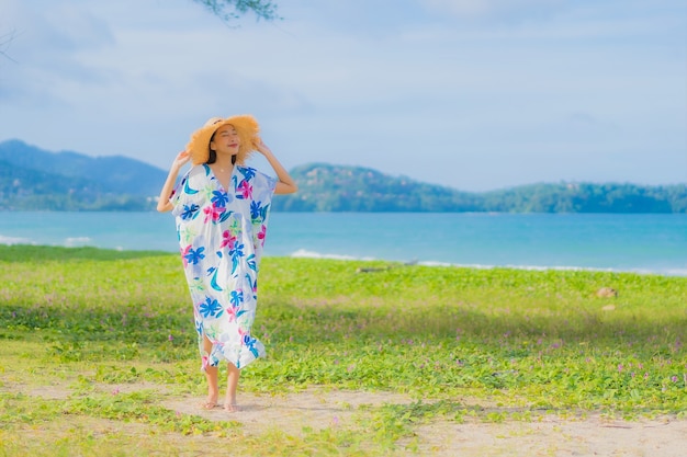 Free Photo portrait beautiful young asian woman relax smile around beach sea ocean in holiday vacation