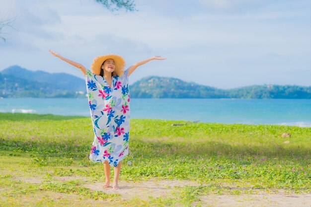 Free Photo portrait beautiful young asian woman relax smile around beach sea ocean in holiday vacation