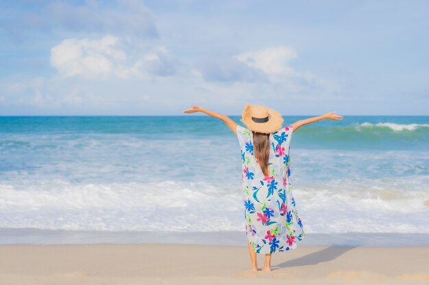 Portrait beautiful young asian woman relax smile around beach sea ocean in holiday vacation