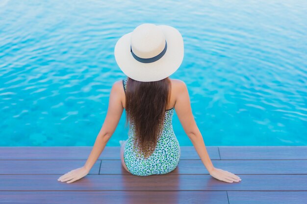 Portrait beautiful young asian woman relax smile leisure around outdoor swimming pool