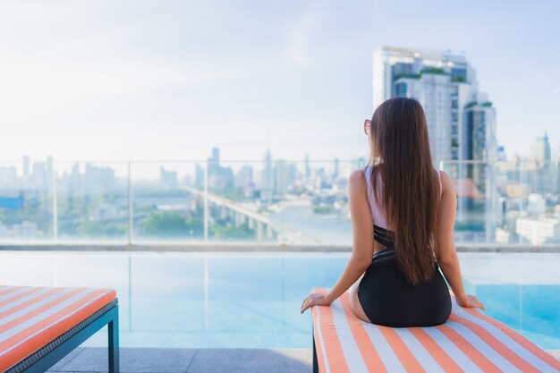 Portrait beautiful young asian woman relaxes leisure around swimming pool