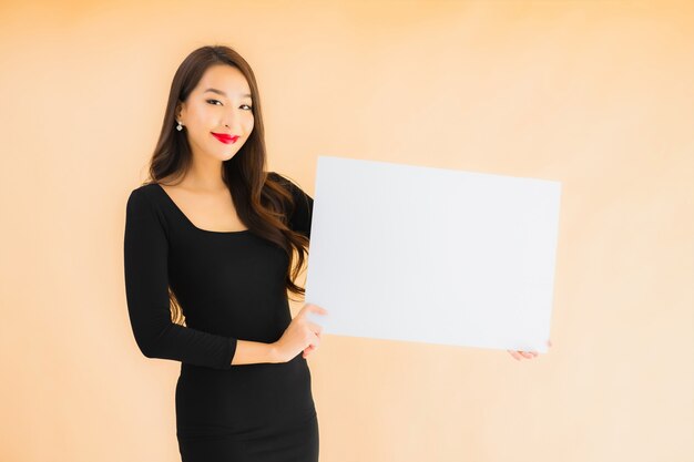 Portrait beautiful young asian woman show empty white board