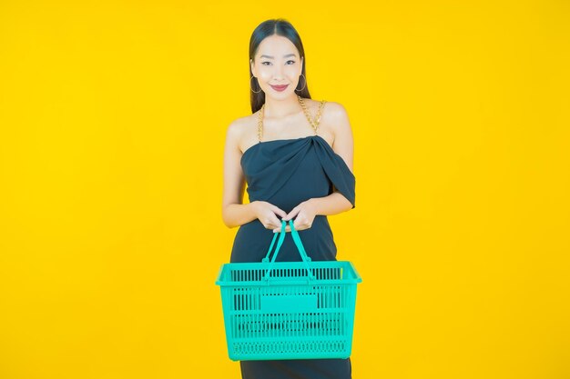 Portrait of beautiful  young asian woman smile with grocery basket from supermarket  