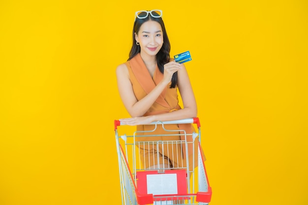Portrait of beautiful  young asian woman smile with grocery basket from supermarket  