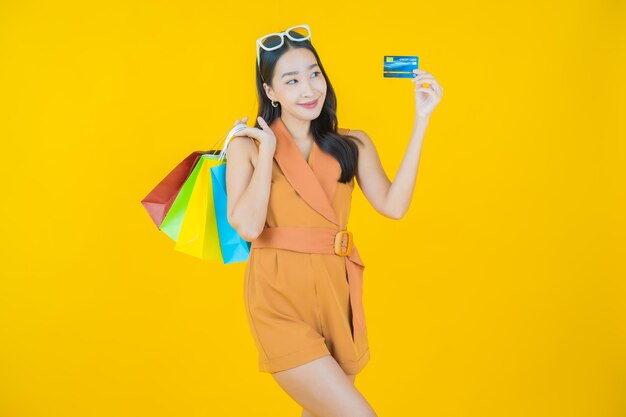 Portrait of beautiful  young asian woman smile with shopping bag  