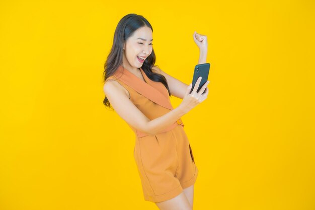 Portrait of beautiful  young asian woman smile with smart mobile phone  