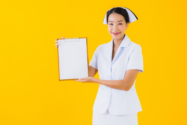 Portrait beautiful young asian woman thai nurse with empty white board