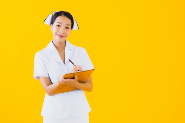 Portrait beautiful young asian woman thai nurse with empty white board