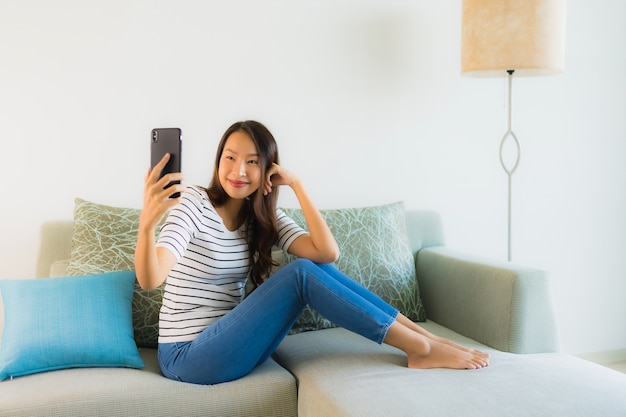 Portrait beautiful young asian woman using or talking mobile phone