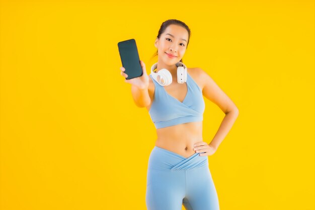Portrait beautiful young asian woman wear sport wear with smartphone