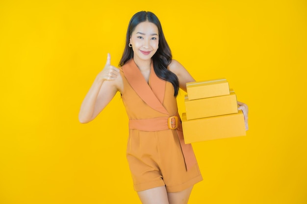 Portrait of beautiful  young asian woman with box ready for shipping  