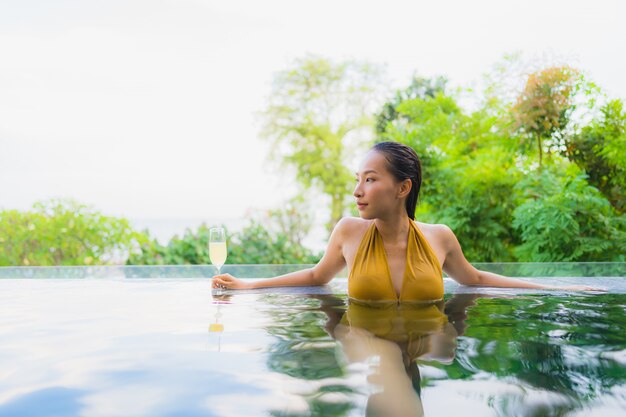 Portrait beautiful young asian woman with champagne glass for relax leisure