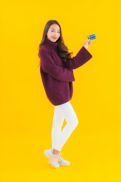 Portrait beautiful young asian woman with credit card for online shopping