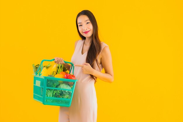 Portrait beautiful young asian woman with grocery basket shopping bag