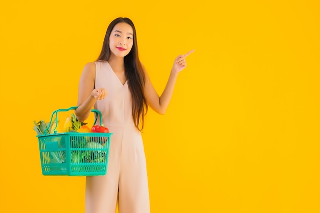 Portrait beautiful young asian woman with grocery basket shopping bag