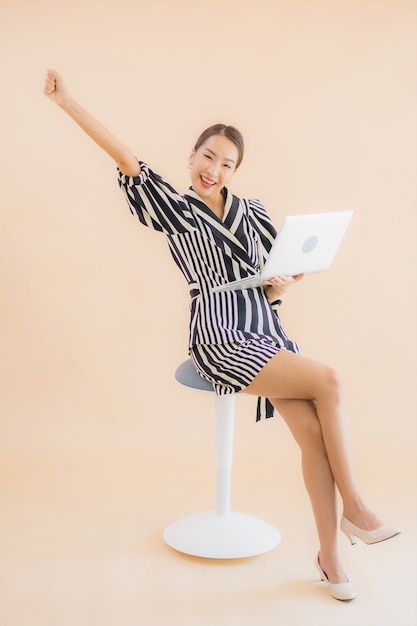 Free photo portrait beautiful young asian woman with laptop or computer