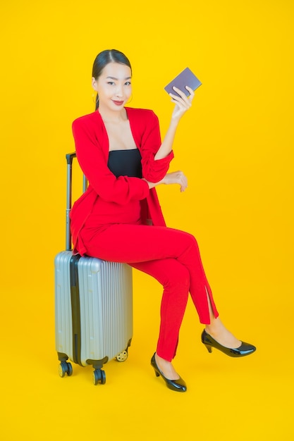 Free photo portrait beautiful young asian woman with luggage bag and passport ready for travel