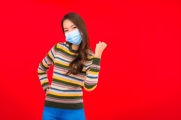 Portrait beautiful young asian woman with mask for protection covid19