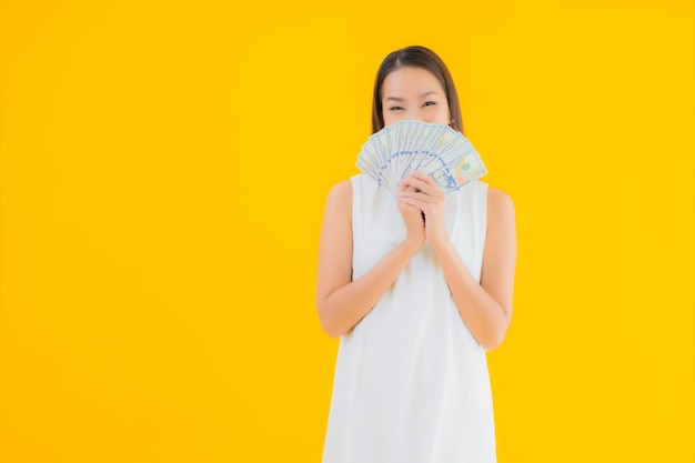 Portrait beautiful young asian woman with money cash