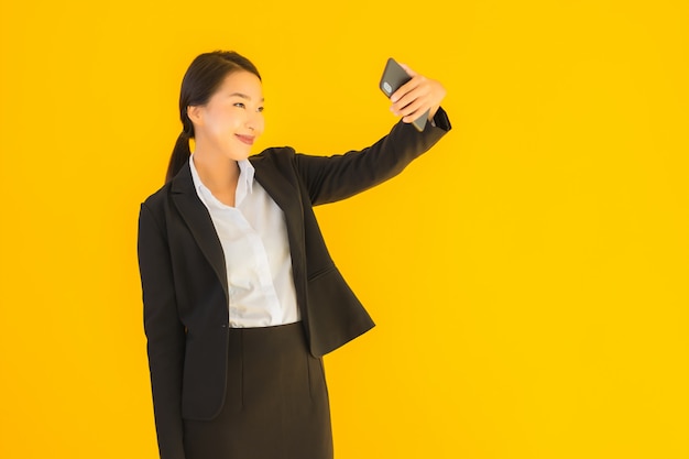 Portrait beautiful young asian woman with phone and coffee cup