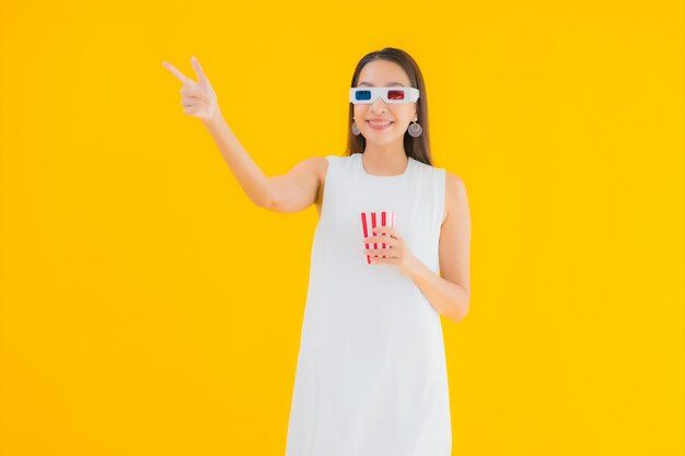 Portrait beautiful young asian woman with popcorn and 3d eyeglasses